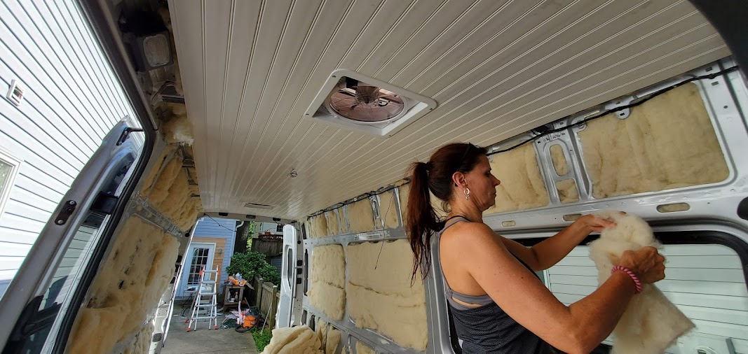 Havelock wool insulation being fitted inside the van during the build